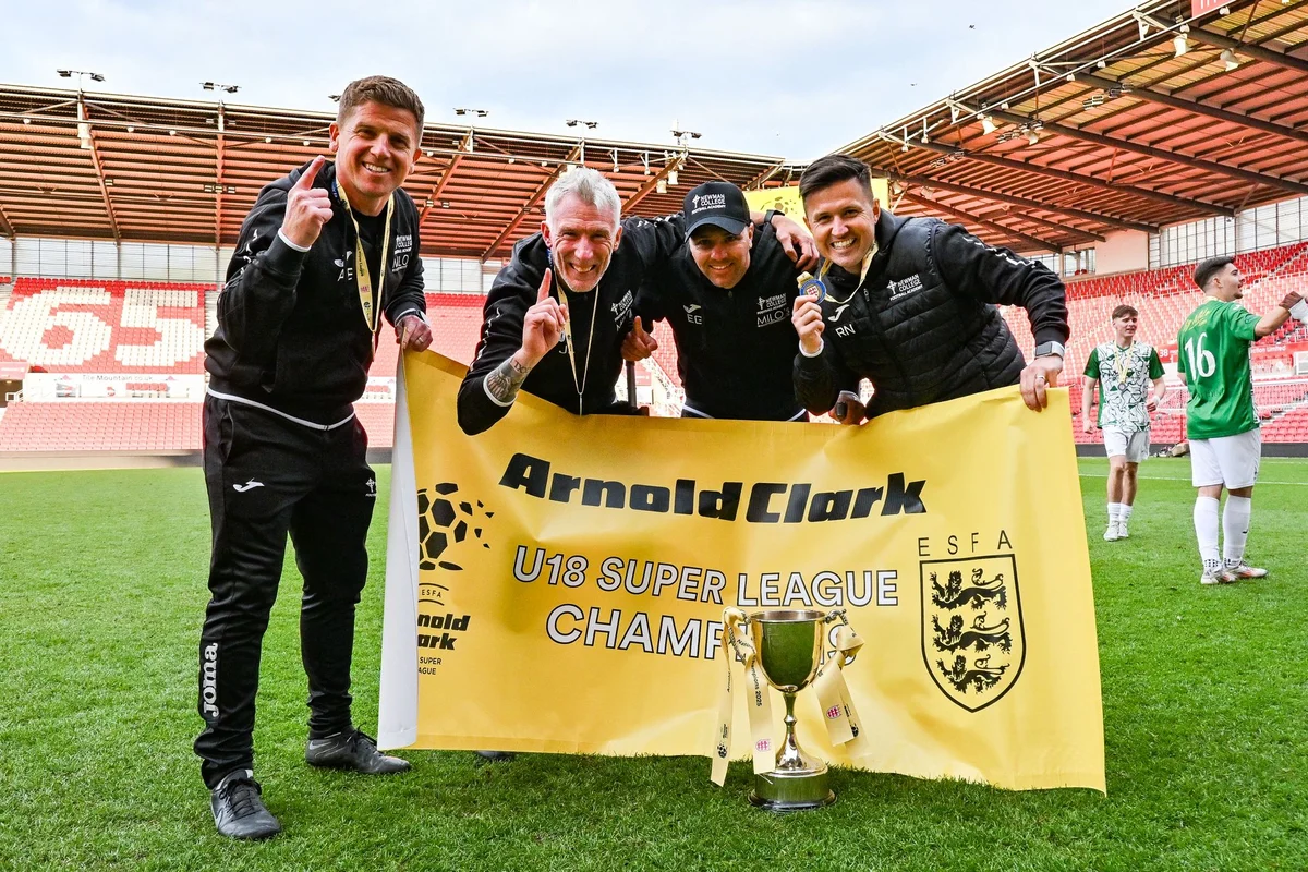 Coaching staff celebrating U19 Super League championship