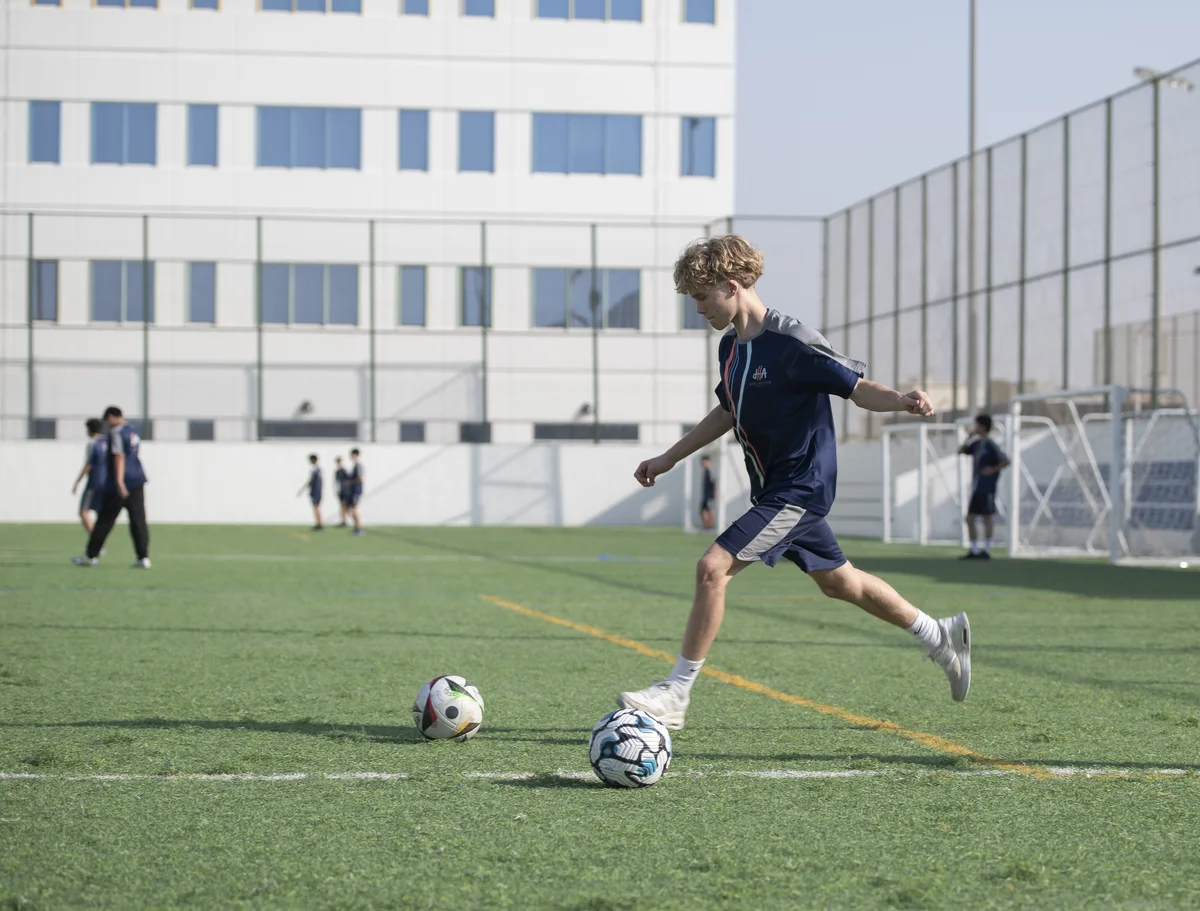 Football Academy player in action at Dubai Heights Academy