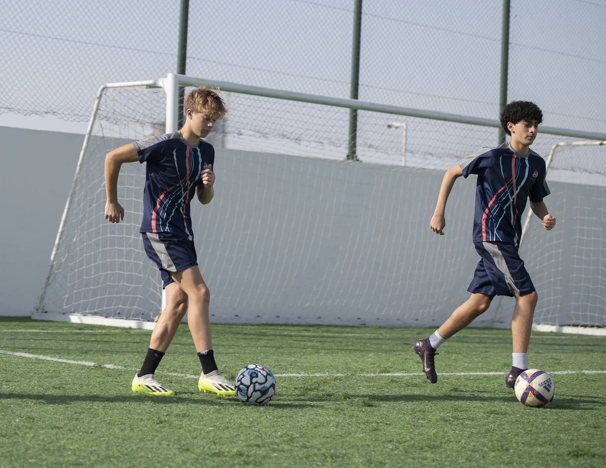 Two football academy players training together
