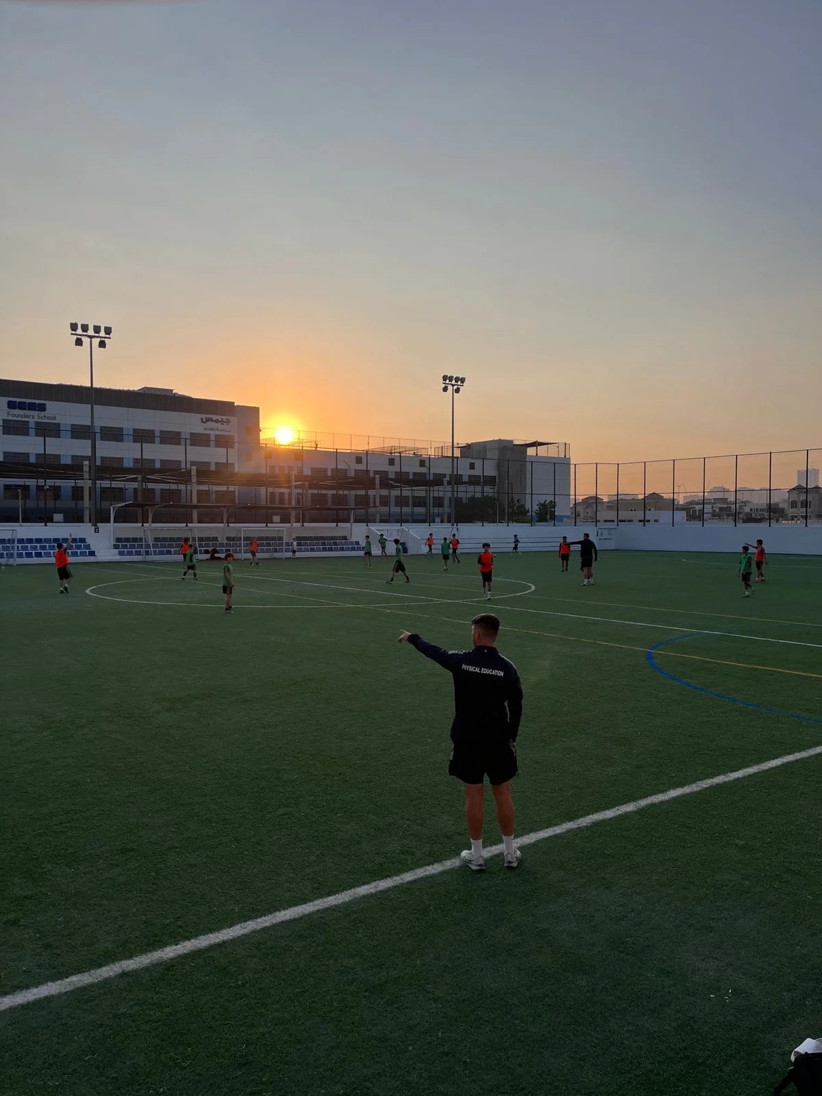 Football training session at sunset