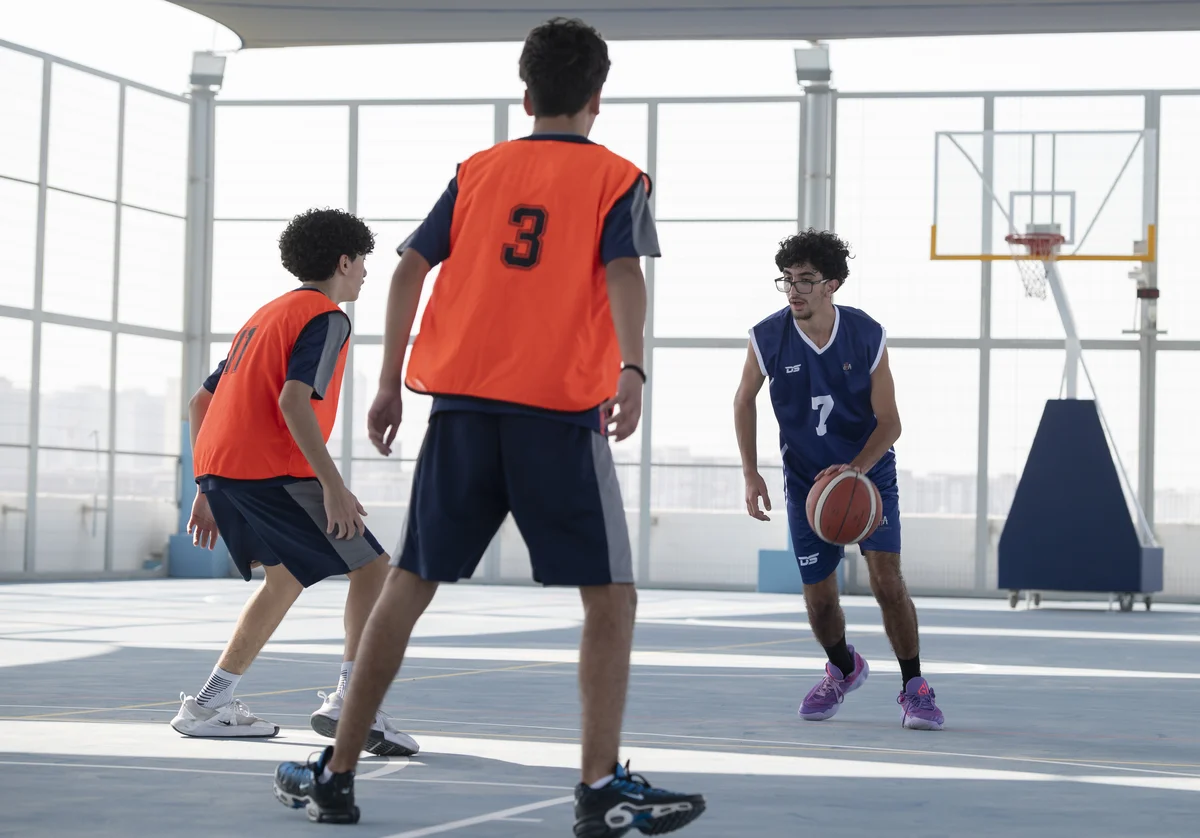 Students playing basketball