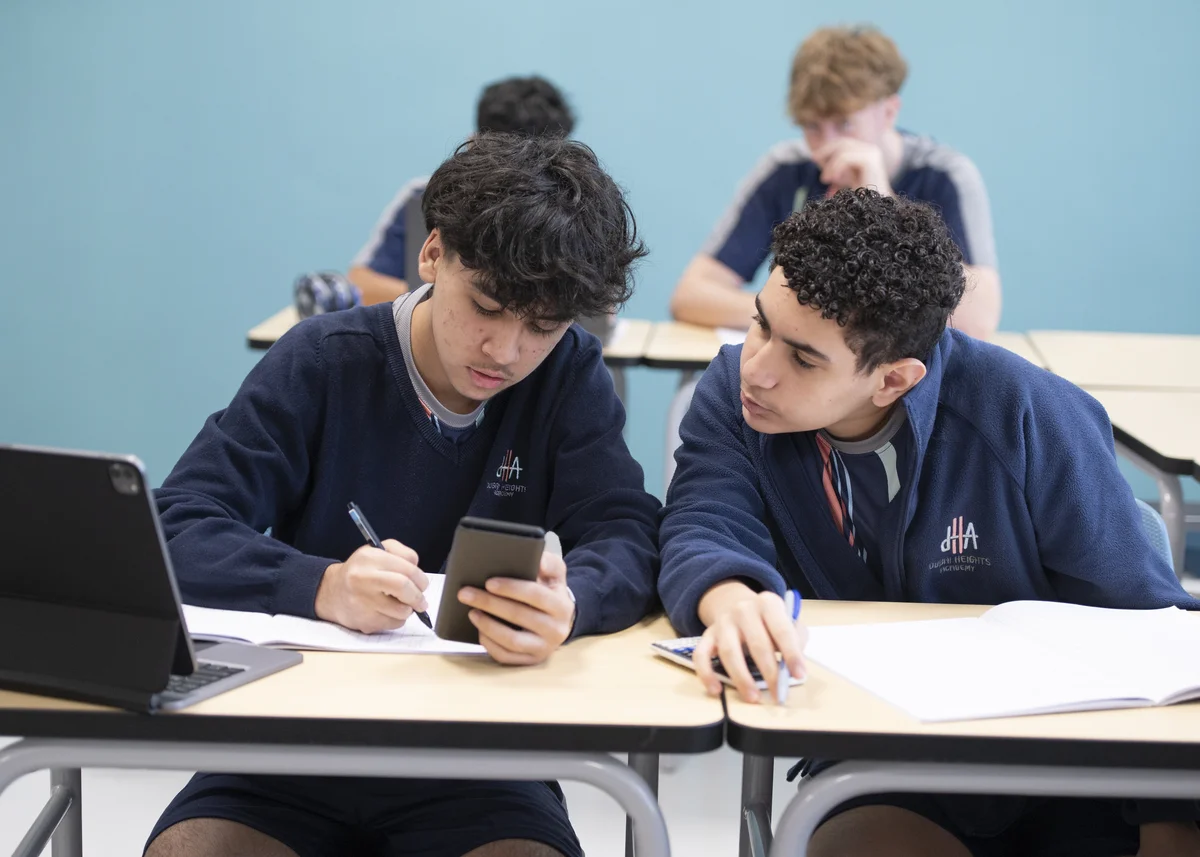 Students collaborating with tablets