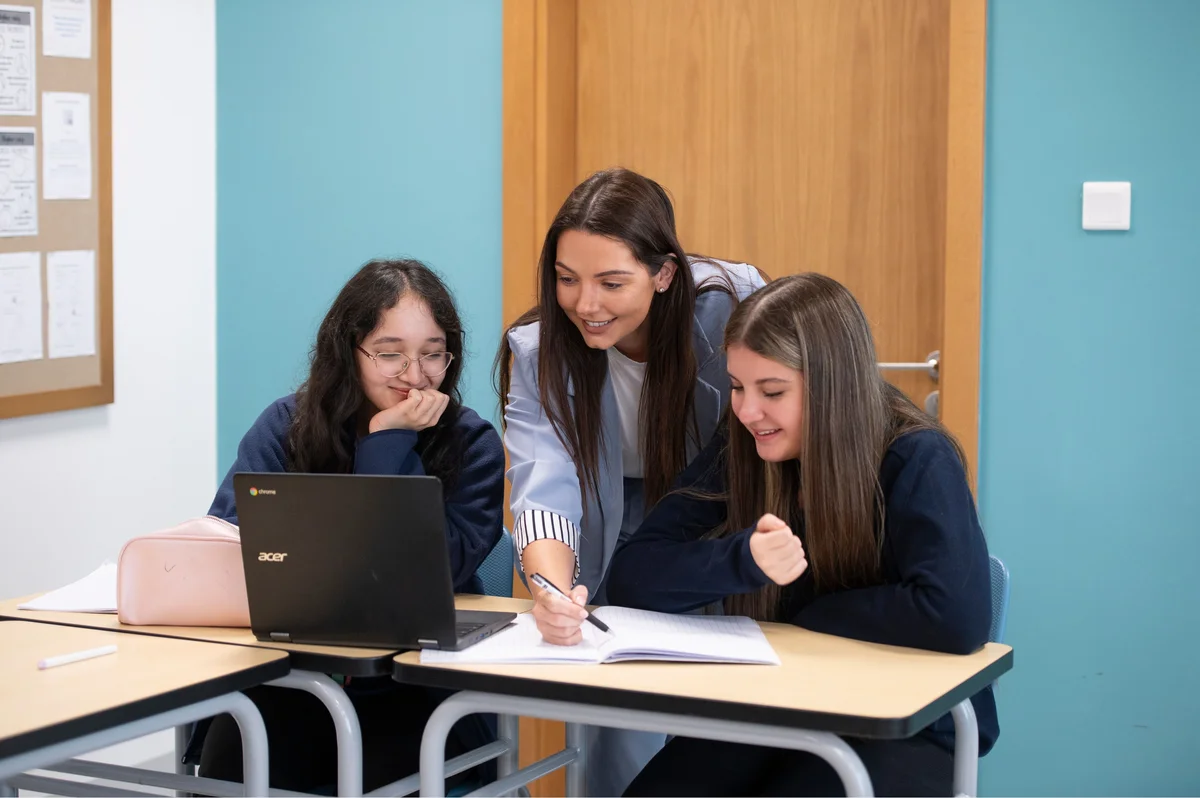 Teacher with students in classroom